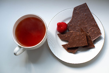 black tea and strawberries with chocolate
