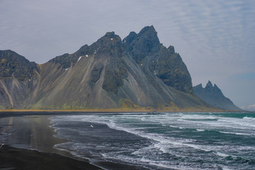 The Vestrahorn mountain on the Icelandic coast jut directly out of the ocean