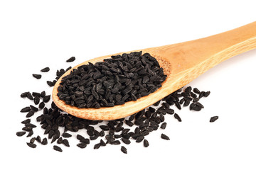 Nigella sativa or Black cumin in wooden spoon isolated on white background