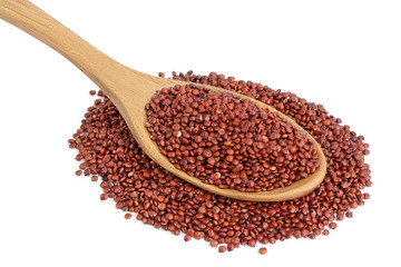 red quinoa seeds in wooden spoon isolated on white background with clipping path and full depth of field