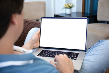 man working on laptop with isolated screen at home