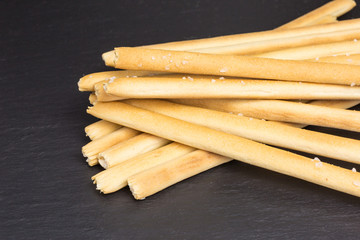 heap of mediterranean grissini bread sticks with salt