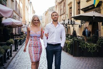 Romantic tourist couple walking around the city relaxing