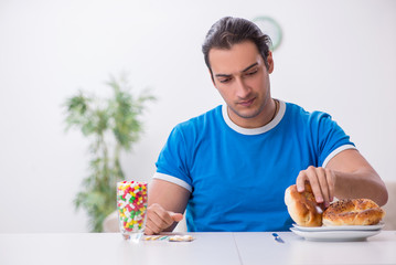 Young hungry man in dieting concept