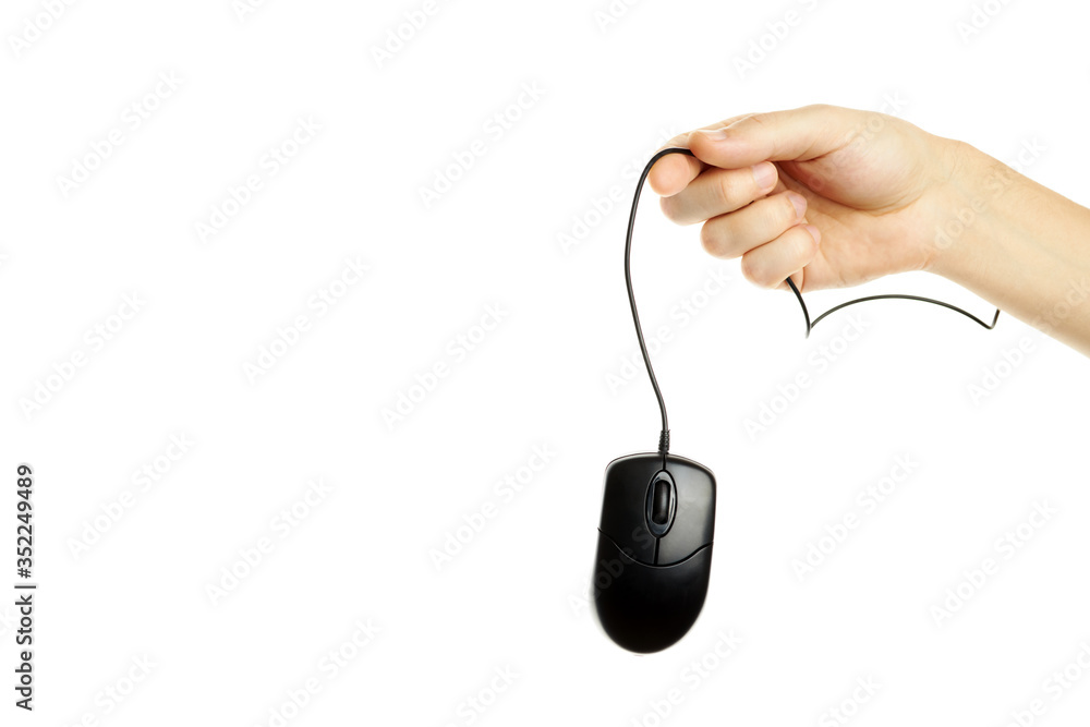 Wall mural black computer mouse at caucasian person hand. isolated on a white background. hardware and web surf