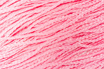 Fototapeta premium Beauty pastel background. Beautiful pink braids backdrop. Space for text and design. Trendy shades of the texture. Close up
