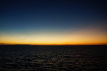 Sunset/sunrise on the ocean. Seen from a cruise