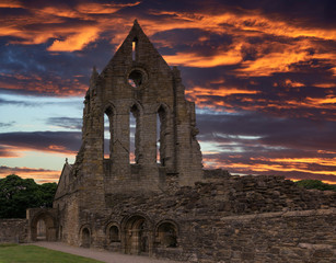 The Old Transept of the Ancient Ruins Kilwinning Abbey Scotland with a dramatic sunset