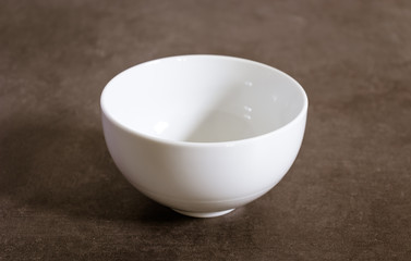 Empty polished white Ceramic bowl on a table