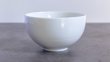 Empty polished white Ceramic bowl close up