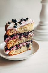 A piece of delicious berry cake on a saucer.