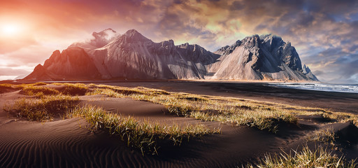 Impressive view of Vestrahorn mountaine on Stokksnes cape in Iceland during sunset. Amazing Iceland nature seascape. popular tourist attraction. Best famouse travel locations. Scenic Image of Iceland