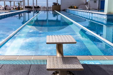 Swimming pool with jumpstand and swimming lanes
