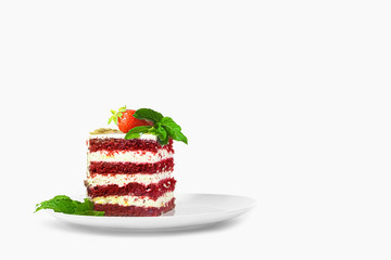Slice of homemade cake with strawberries on a plate on a white background close-up