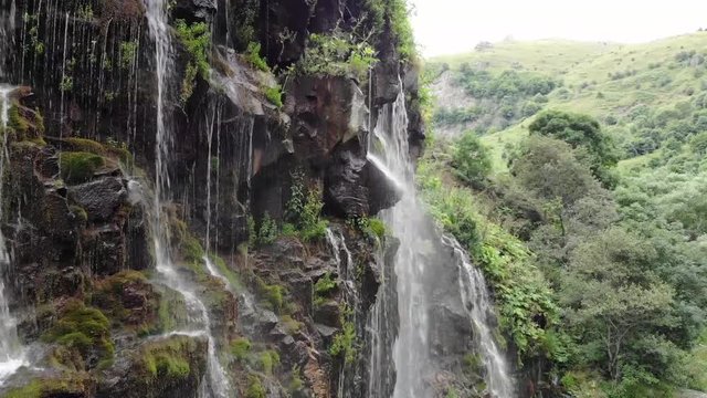 Aerial view of waterfall and canyon with river. Dashbashi, Georgia.