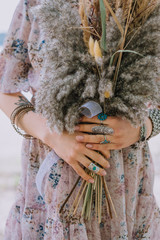 boho girl holding a bouquet