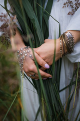 boho girl holding a bouquet