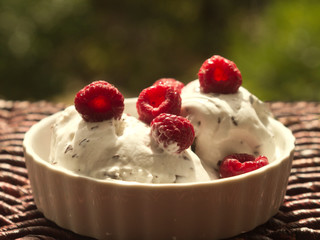 Bowl of ice cream with raspberries