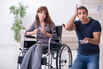 Disabled wife and young husband at home