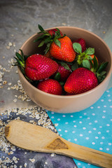 tomorrow from strawberries in a plate on a dark background