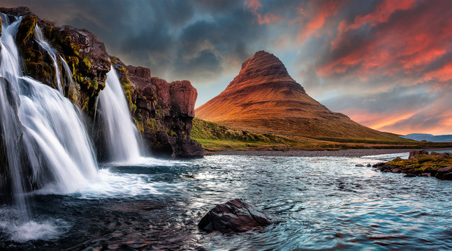Scenic image of Iceland. Incredible Nature scenery during sunset. Great view on famous Mount Kirkjufell with Colorful, dramatic sky. popular plase for photografers. Best famous travel locations.