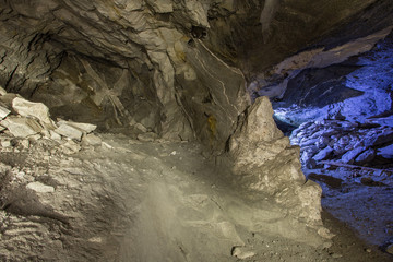 Underground old mica mine tunnel with light