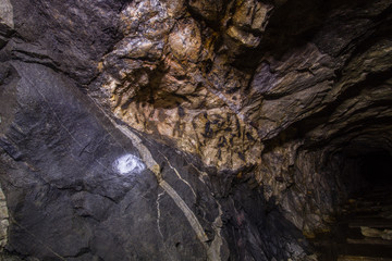 Underground old mica mine tunnel with veins