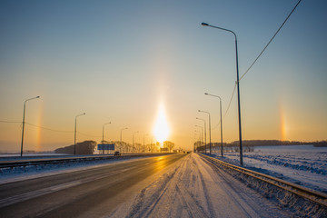 Halo sunset at morning on the road