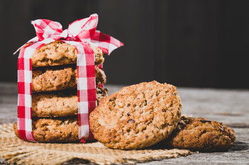 oatmeal cookies on wooden background, close-up