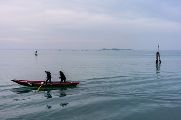 Fototapeta na wymiar Italy, Venice, December 12 2018.Boat on the lagoon.