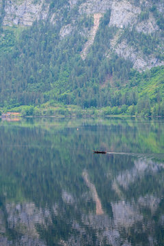 View of a "Pl&auml;tte", a traditional wooden flat-bottomed boat, on Lake Hallstatt, Salzkammergut region, Austria
