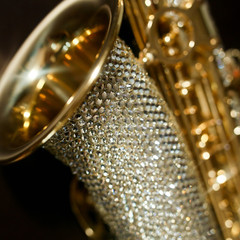 gold saxophone in gold rhinestones, close angle
