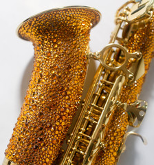 gold saxophone in gold rhinestones, close angle