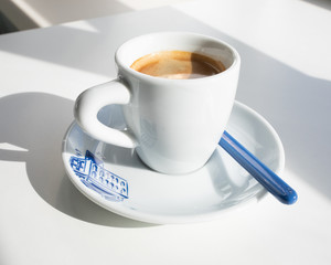 Espresso in a white cup with a blue print