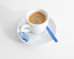 Espresso in a white cup with a blue print