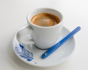 Espresso in a white cup with a blue print