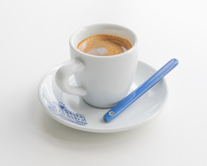 Espresso in a white cup with a blue print
