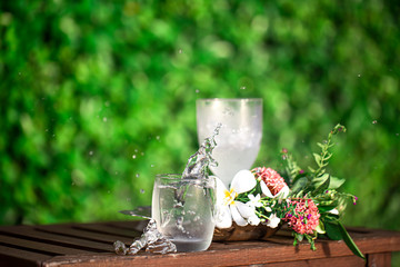 Glass of water on a wooden background