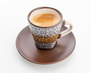 Espresso in a brown cup with a white print