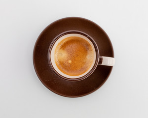 Espresso in a brown cup with a white print