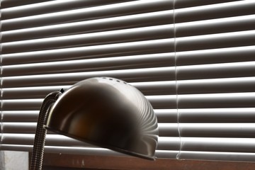 silver desk lamp in home office. modern office interior.