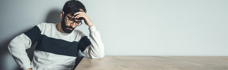 sad man in dark background