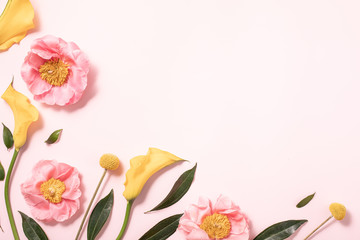Obraz na płótnie Canvas Flower layout in flat style on pastel pink backgro