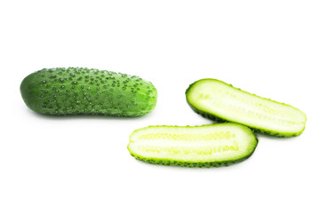 Fresh organic cucumber and two halves of a cucumber isolated on white background