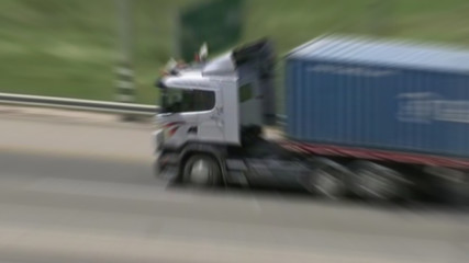 Cargo delivery truck in blurry motion on road.ready to satisfied costumers.