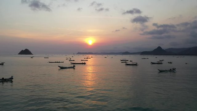 Asian Fishing Boats on the Ocean at Sunset in Lambok, Indonesia - Aerial Drone
