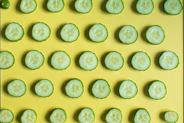 cucumber slices are placed on a colored glass table