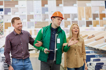 pleasant warehouse worker glad to help customers, they asked for consultation, worker love his job, he is socially adapted