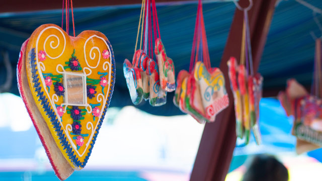 Licitars hearts and gingerbread in the shape of a horse hanging below the festivals tent.