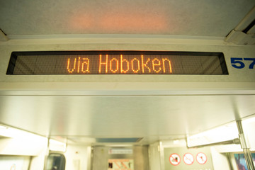 New York, NY - May 16 2020: The Path Train going from New Jersey to NYC sign saying via hoboken...